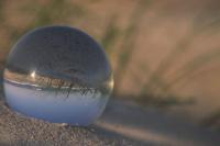 Glass ball in the sand