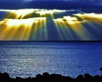 sunlight thru clouds at beach