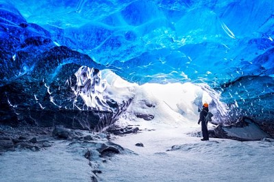 Traveler in ice cave, Vatnajokull National Park