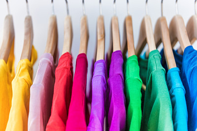 Fashion clothes on clothing rack - bright colorful