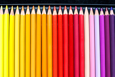 Line of colorful pencils on black velvet backgroun jigsaw puzzle