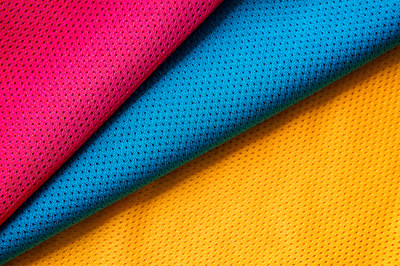 Red, blue and yellow jersey fabric texture backgro