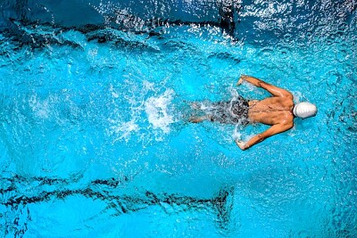 Man Swimming in the Pool