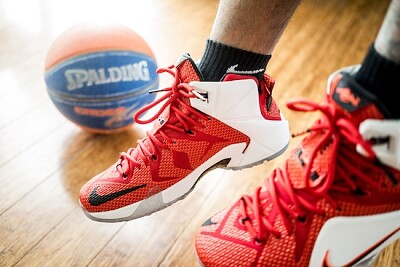 Nike Lebron sneakers and Spalding basketball
