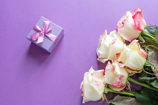 Festive flowers English rose composition on a purp