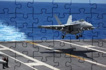 plane landing on aircraft carrier