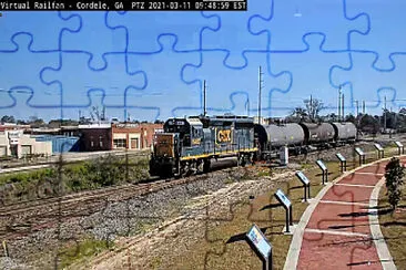 CSX-6487 at Cordele,GA/USA pulling tank cars jigsaw puzzle