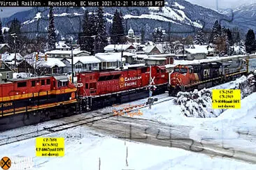 CN-2945, CN-3969 meets CP-7059   KCS-5012 at Revelstoke, in the Snow jigsaw puzzle