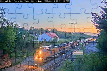 train passing the La Plata,MO/USA Amtrak Depot at La Plata,MO/USA jigsaw puzzle