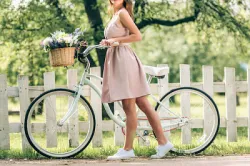 Woman Riding a Retro Bycicle
