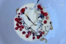 Berries in cream with balsamic drizzle
