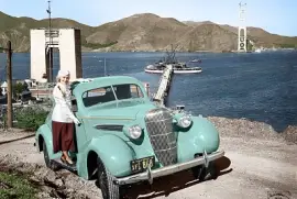 1935 Oldsmobile coupe and Golden Gate Bridge under