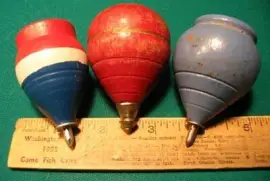 large wooden spinning tops