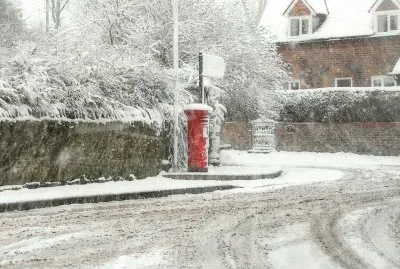 Village post box snow scene