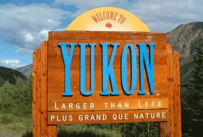 Yukon sign among the Road