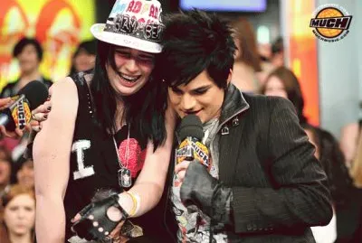 adam lambert hugging a girl