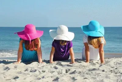 Girls in Floppy Easter Hats at the Beach
