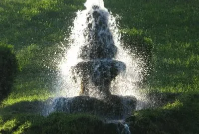 Water fountain in setting sun