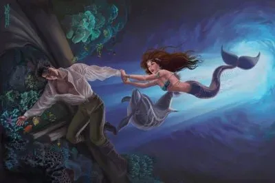 Sirena con hombre en el fondo del mar