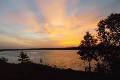 Sunrays at dusk over Miramichi River