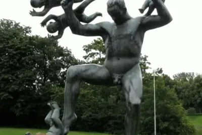 Sculpture of Man balancing babies