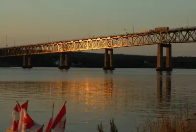 Centennial Bridge Miramichi in setting sun   L