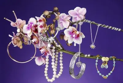 Hanging Jewelry Against Purple Back Ground
