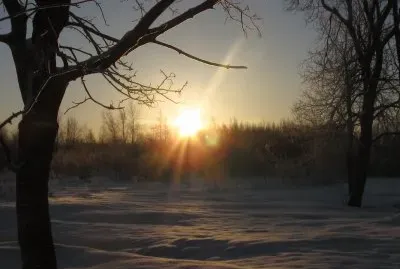 Winter sunrise across field