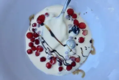 Berries in cream with balsamic drizzle
