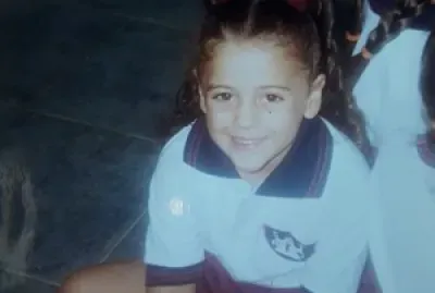 This is me when I was 5 years old. I went to Santa Teresa school