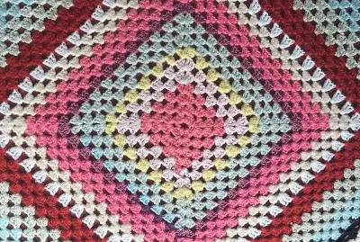 crocheted rug- pink center