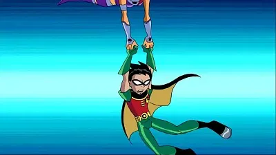 starfire sostiene a robin en el aire los jovenes titanes
