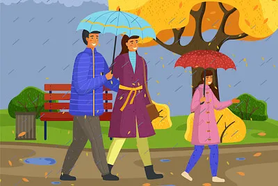 雨の中を歩く家族