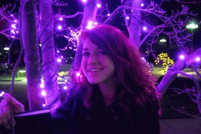Glowing Girl Under Purple Lights