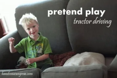 kid pretends to drive his tractor