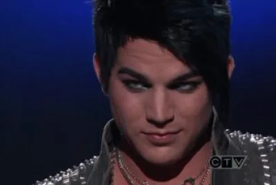 adam lambert giving simon cowel a well face