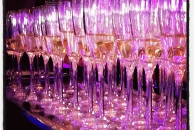 Serving  the Champange under a Purple Hue