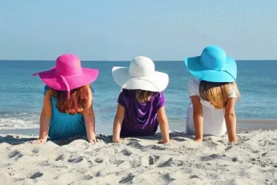 Girls in Floppy Easter Hats at the Beach