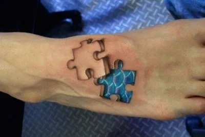 jigsaw piece foot tattoo