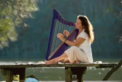 Playing Purple Harp by Peaceful Lake