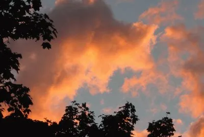 Colourful clouds over neighbour 's house