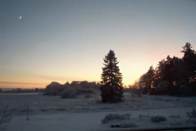 Winter sunset and new moon, Sweden