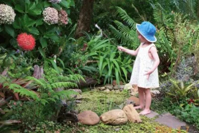 Little girl and fish pond, South Africa