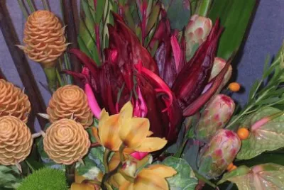 Orange and burgundy flower arrangement