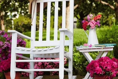 White Rocking Chair with Potted Azaleas