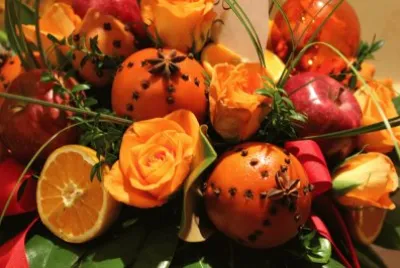 Vibrant Floral Design with Fruits and Cloves