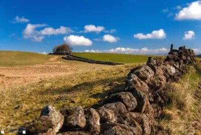 stone wall blue sky trees landscape jigsaw puzzle