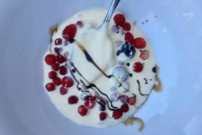 Berries in cream with balsamic drizzle