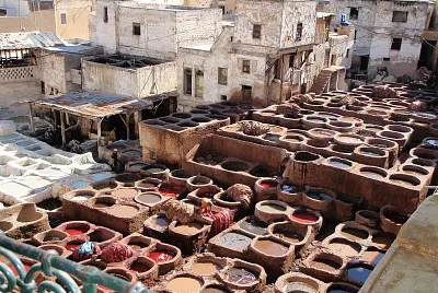 Vats of fabric dye at factory in Morocco