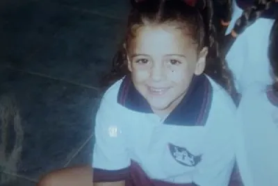 This is me when I was 5 years old. I went to Santa Teresa school